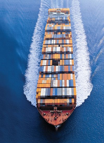 Sea freight shipping containers stacked at a port