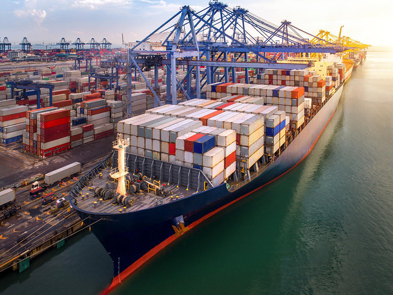 Sea freight shipping containers stacked at a port
