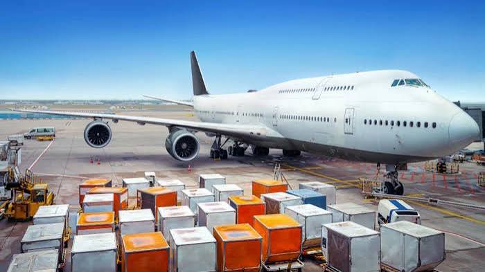 Air freight cargo plane being loaded on the tarmac